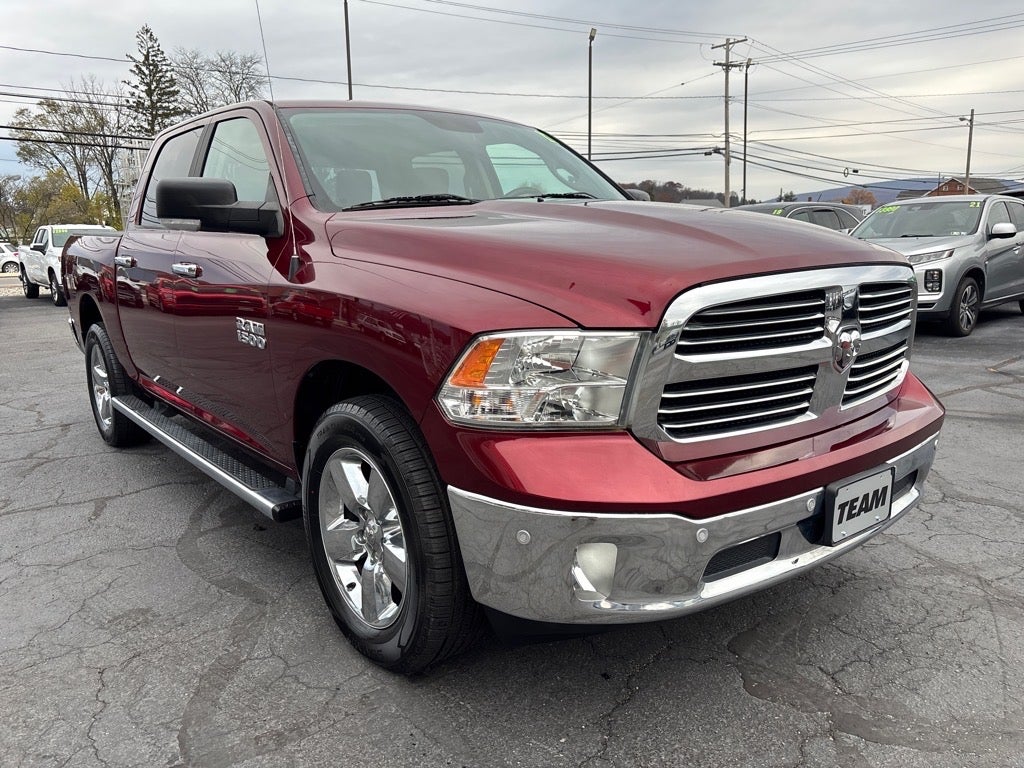 2017 RAM 1500 Big Horn in Delmonico Red Pearl Coat — front three-quarter view