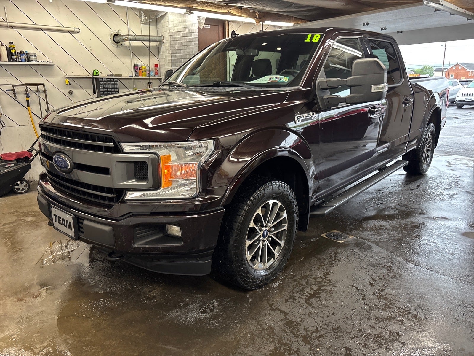 2018 Ford F-150 XLT in Magma Red — front three-quarter view