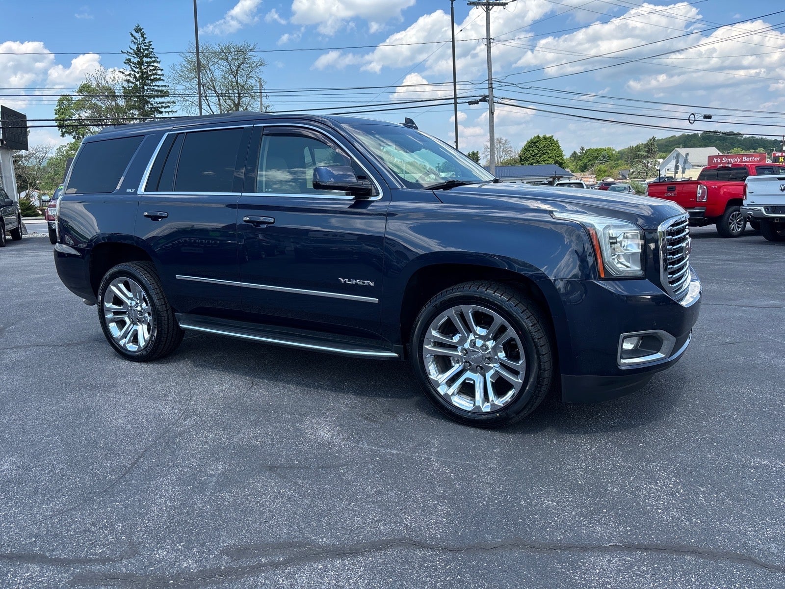 2017 GMC Yukon SLT in Dark Sapphire Blue Metallic — front three-quarter view