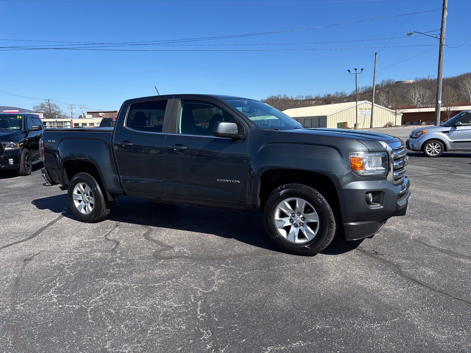 2017 GMC Canyon SLE in Cyber Gray Metallic (Gbv) — front three-quarter view