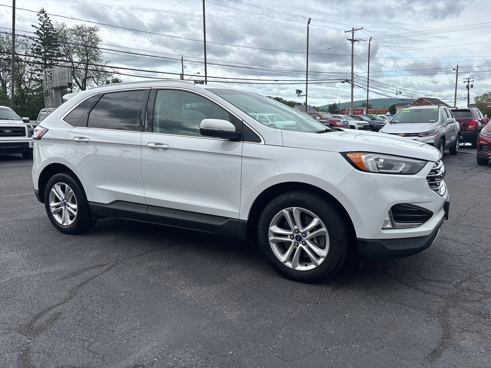 2019 Ford Edge SEL in White Platinum Metallic Tri-Coat — front three-quarter view