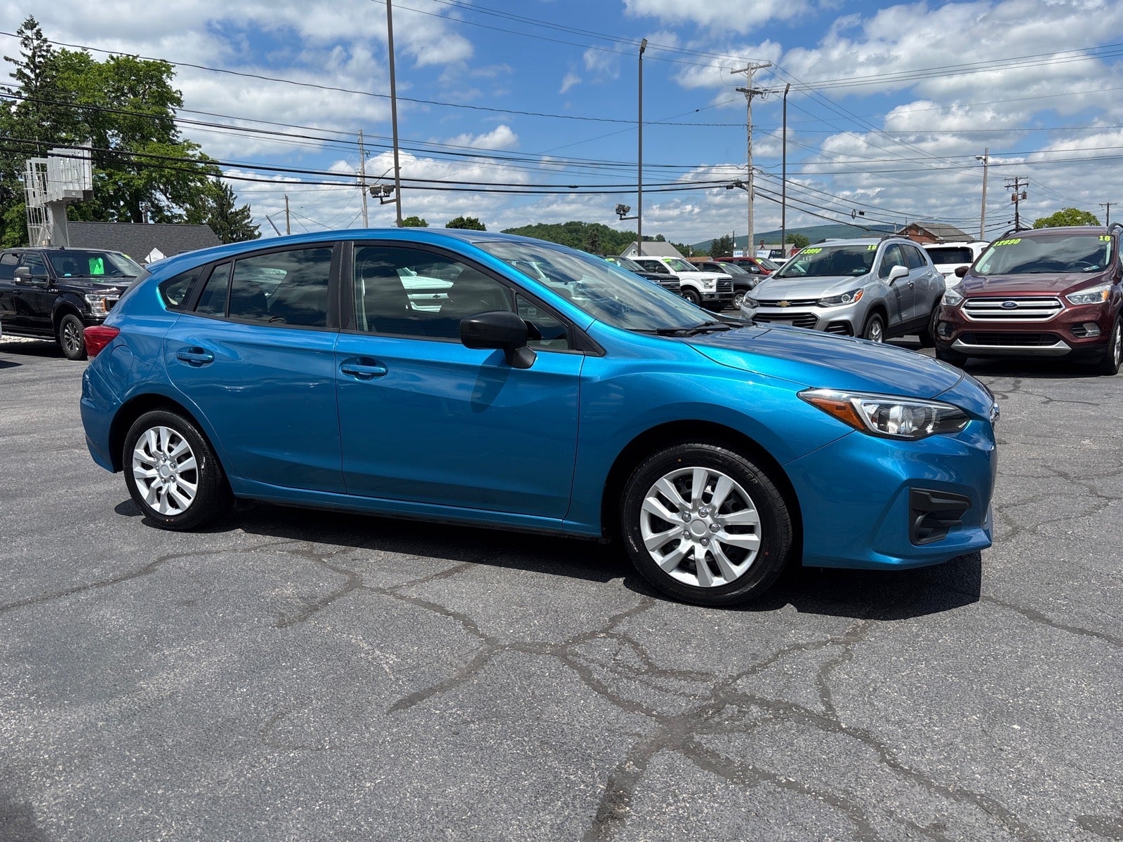 2018 Subaru Impreza 2.0i in Island Blue Pearl — front three-quarter view