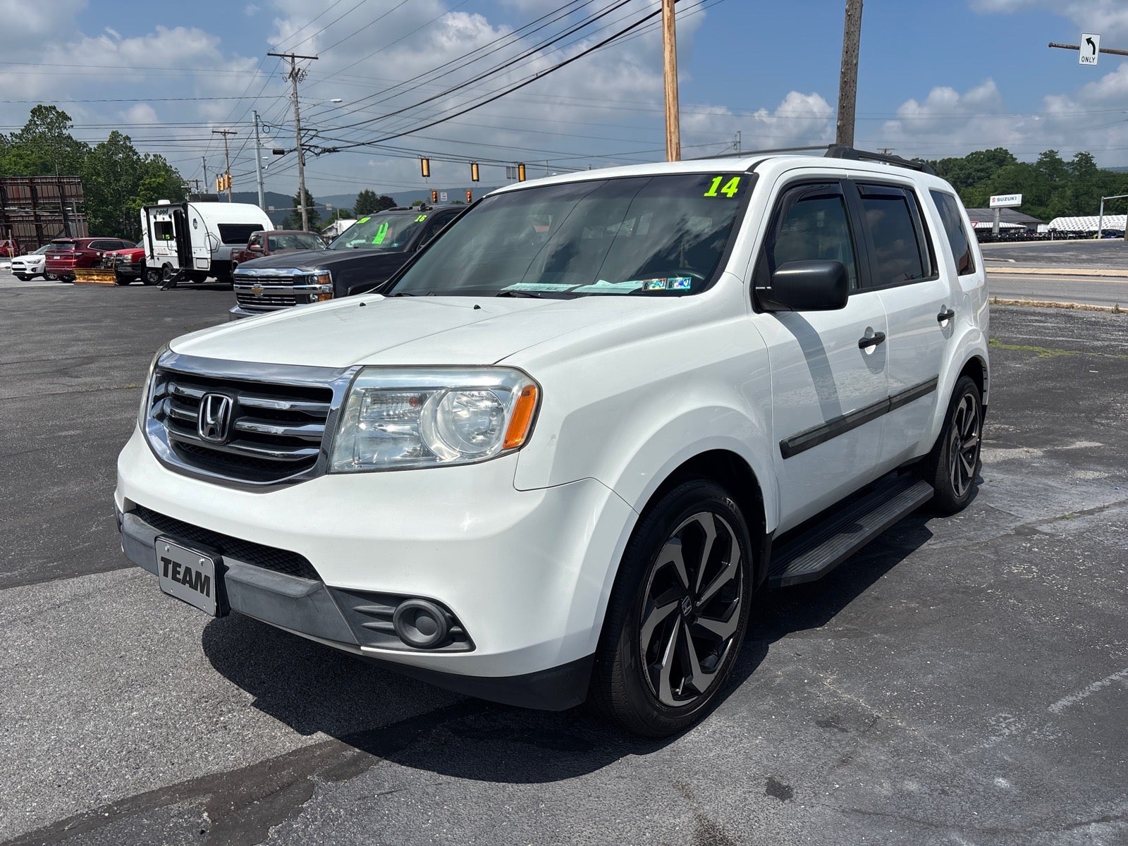 2014 Honda Pilot LX in Taffeta White (Wh) — front three-quarter view