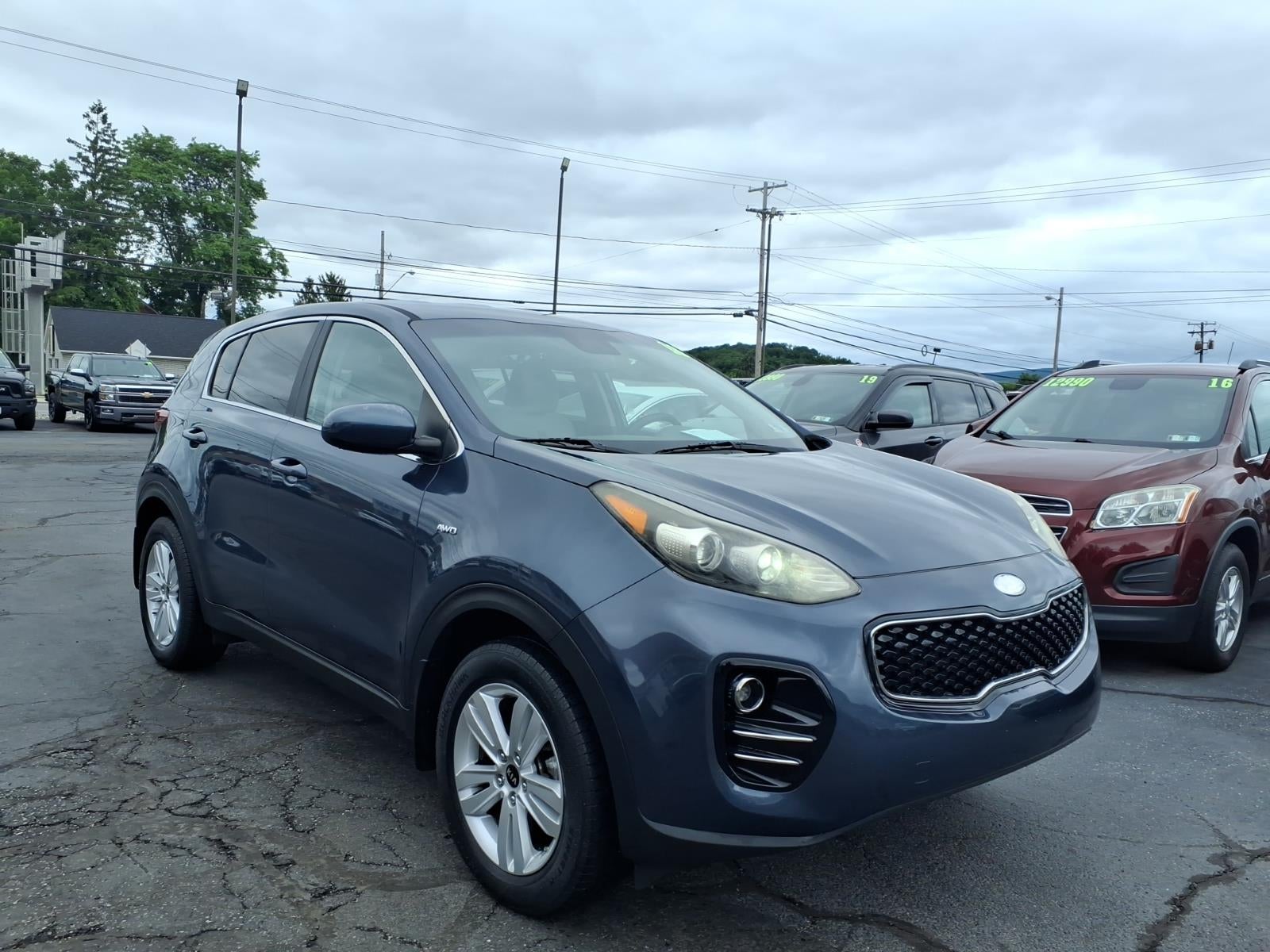 2018 Kia Sportage LX in Pacific Blue Bu2 — front three-quarter view